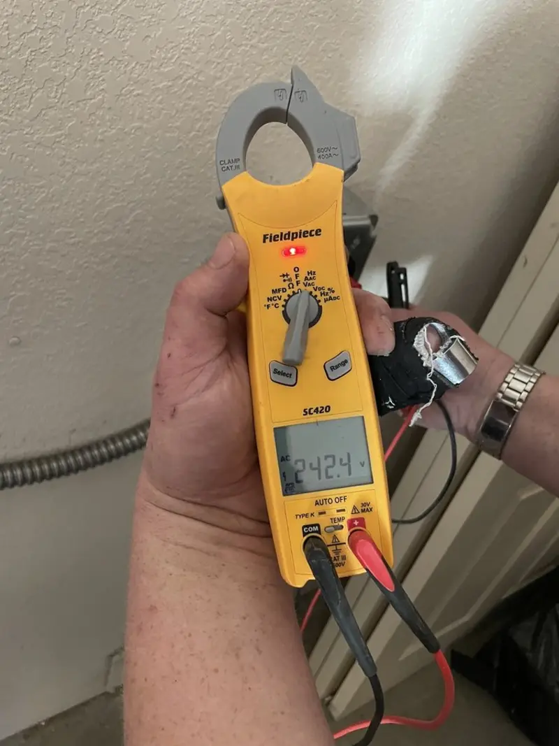 Voltage testing with clamp meter during Generator Installation in California